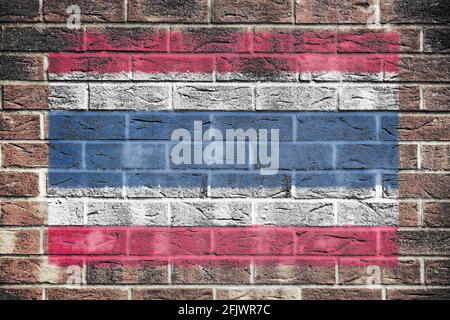 Bandiera della Thailandia su un muro di mattoni sfondo Foto Stock