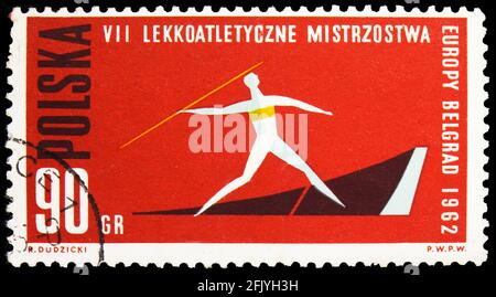 MOSCA, RUSSIA - 27 SETTEMBRE 2019: Francobollo stampato in Polonia mostra Javelin Throw, 7° Campionato europeo di atletica serie, circa 1962 Foto Stock