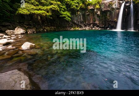 Cascata a Cheonjeyeon cade su di Jeju Island Foto Stock