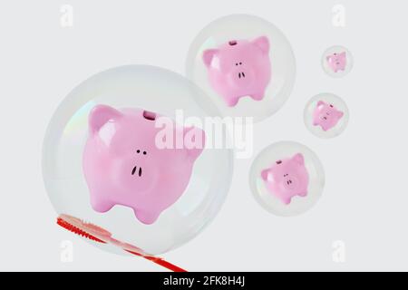 Banche piggy galleggianti in bolle di sapone - concetto di risparmio e insicurezza economica Foto Stock