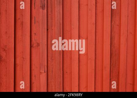 Immagine full frame di una parete di legno dipinta di rosso. Foto Stock