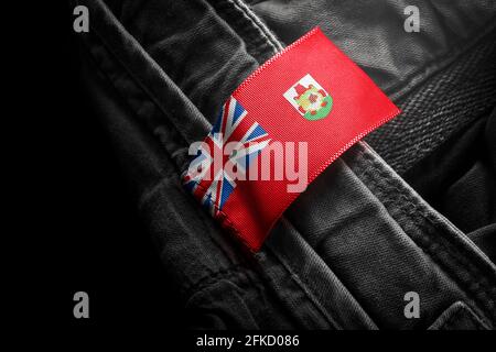 Etichetta su abbigliamento scuro sotto forma di bandiera delle Bermuda Foto Stock