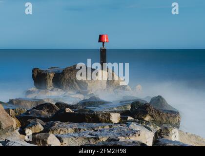 Capanne da spiaggia a Mudespit su Hengitsbury Head, Dorset Foto Stock