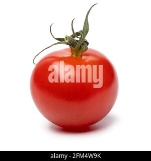Single small ripe red cherry tomato close up isolated on white background Foto Stock