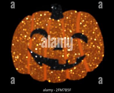 Pumpkin Jack o Lanterna con glitter sfocato Foto Stock