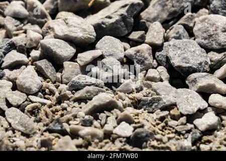 Pietre da vicino su una passerella o su un vialetto per texture o sfondi. Foto Stock