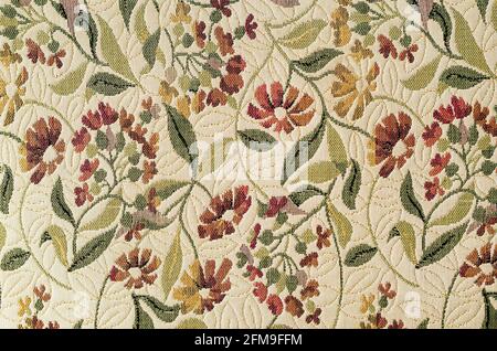 Tappezzeria vintage in tessuto vecchio stile con ornamenti floreali Foto Stock