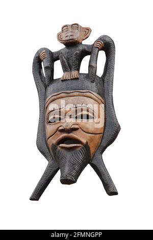Una maschera di legno tribale intagliata e scimmia. Foto Stock