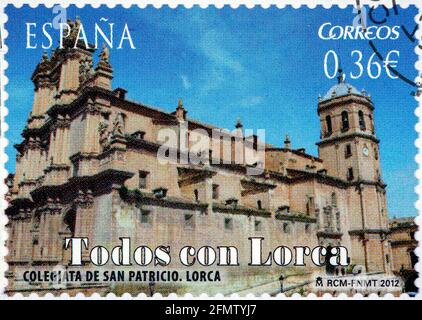 SPAGNA - CIRCA 2012: Un francobollo stampato in Spagna dall'edizione 'Todos con Lorca, Murcia' mostra la Collegiata di San Patricio, circa 2012. Foto Stock