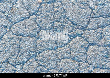 struttura a basso contrasto di asfalto rotto vecchio, vecchia strada o sfondo marciapiede Foto Stock