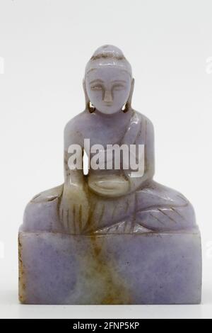 Minaiture pietra Buddha figurine. Francia. Foto Stock