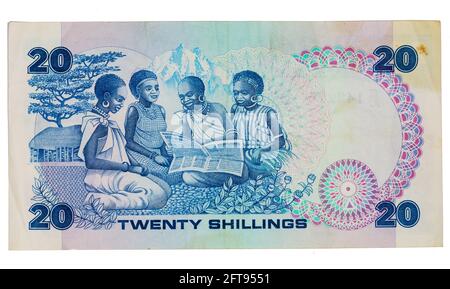 Reverse of a 1986 Central Bank of Kenya 20 Shilling note, mostrando ragazze che leggono un giornale. Foto Stock
