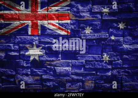 Bandiera nazionale dell'Australia sulla parete di pietra background.The concetto di orgoglio nazionale e simbolo del paese. Bandiera banner su pietra texture backgroun Foto Stock