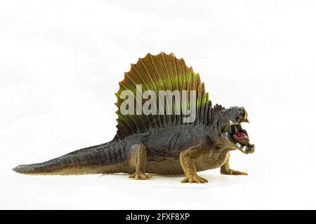 dinosauro giocattolo in plastica isolato su sfondo bianco Foto Stock