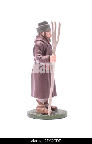 Un soldato in stagno con una forchetta isolata su bianco Foto Stock