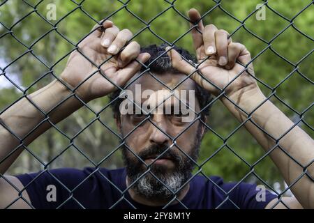 Dettaglio della disperazione e della paura, degli arresti e della criminalità, dell'immigrazione Foto Stock