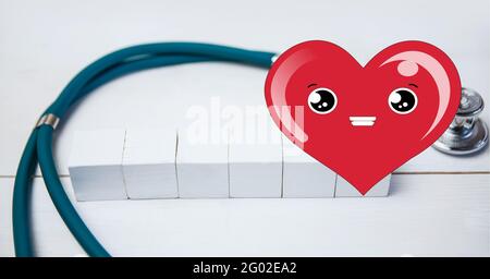 Composizione dell'icona del cuore su stetoscopio e blocchi bianchi con spazio di copia su sfondo bianco Foto Stock