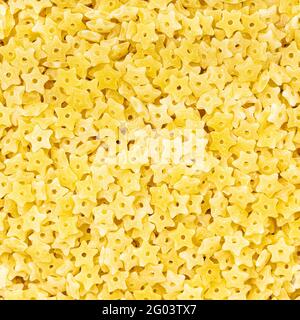 fondo cibo quadrato - pastina stellina cruda primo piano Foto Stock