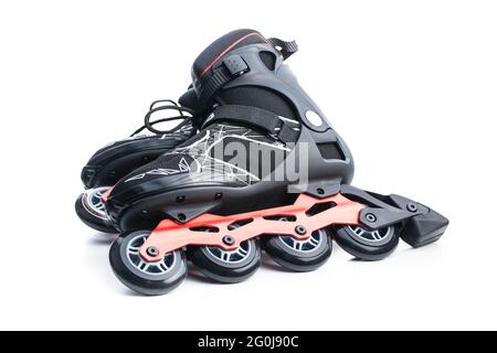 Pattini a rotelle in linea isolati su sfondo bianco. Foto Stock