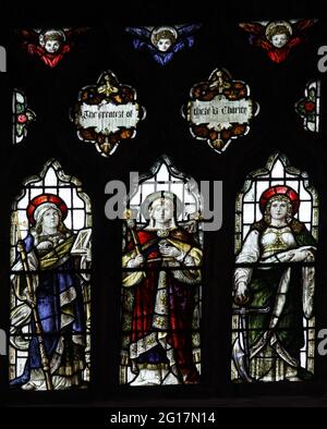 Vetrate colorate di Percy Bacon & Brothers raffiguranti fede, speranza e carità, Lady St Mary Church, Wareham, Dorset Foto Stock