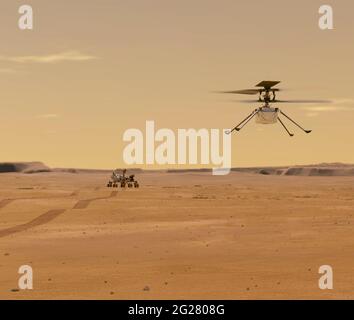 Il concetto di artista di Marte Ingenuity drone che vola sopra la perseveranza rover sul pianeta Marte. Foto Stock