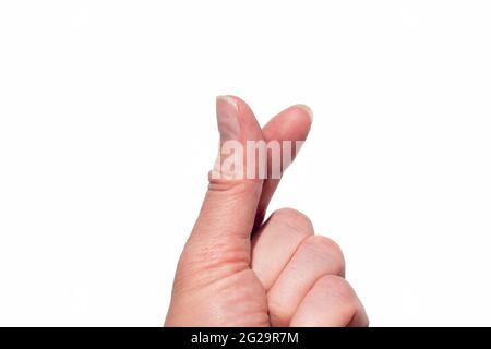 Una mano che forma un cuore con due dita su uno sfondo bianco isolato. Simbolo coreano dell'amore con le dita. Cuore del dito. Mini cuore mano del dito Foto Stock