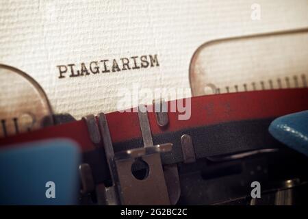 La parola plagio scritto con una macchina da scrivere. Foto Stock