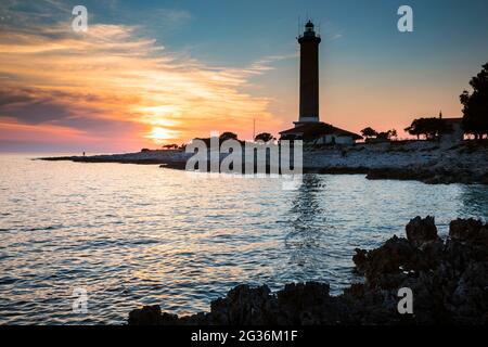 Faro Veli Rat al tramonto, isola Dugi otok Foto Stock