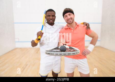 Squash giocatori sorridente Foto Stock