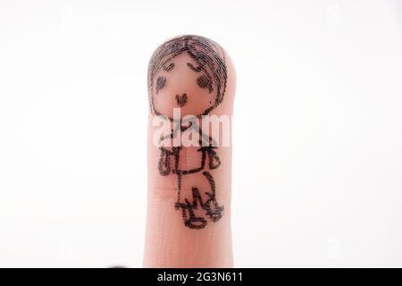 Figura bambino disegnata sulla punta di un dito Foto Stock