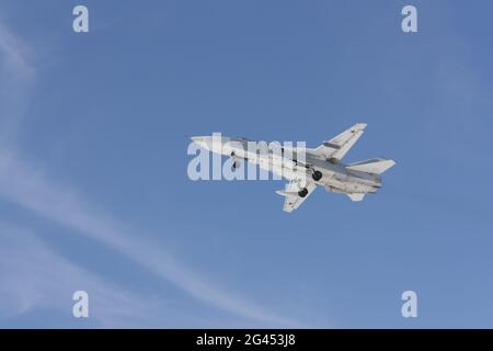 Military jet bomber Su-24 Fencer flying Stock Photo