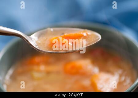 Primo piano della cena di Jigg, maiale bollito marittimo e zuppa di verdure Foto Stock