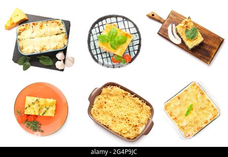 Set di gustose lasagne fatte in casa su sfondo bianco Foto Stock