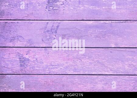 Sfondo con vecchie tavole di legno orizzontali con vernice scheggiata Foto Stock