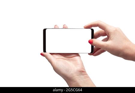 Smartphone orizzontale in una mano femmina, design moderno senza cornice. Isolato su sfondo bianco. Con tracciato di ritaglio Foto Stock