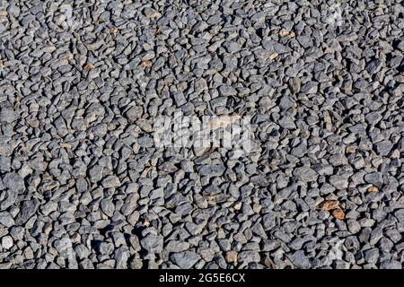 Consistenza di ciottoli. Stone Road. La consistenza della strada ghiaiosa. Foto Stock