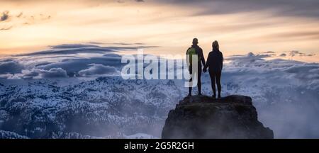 Fantasy Adventure Composite of a Man and Woman Couple on a Rocky Mountain Foto Stock