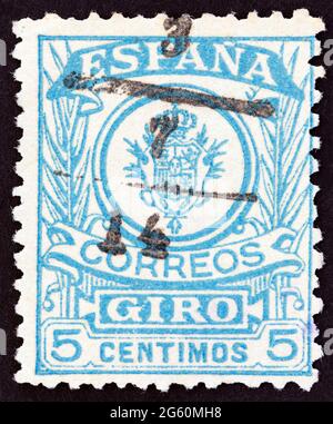 SPAGNA - CIRCA 1920: Un francobollo stampato in Spagna mostra emblema, circa 1920. Foto Stock