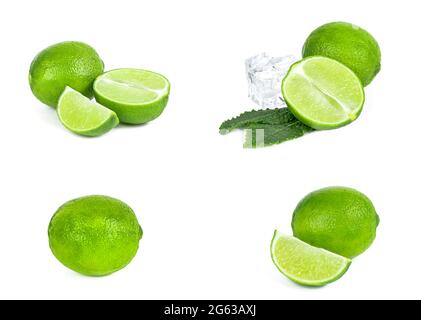 Lime fresche verdi succose, fette di lime, ghiaccio e foglie di menta sono isolate su sfondo bianco. Foto Stock