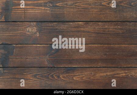 Tessuto di fondo in legno marrone vintage. Sfondo di legno scuro. Vecchio marrone rustico legno scuro tessitura. Rustico marrone legno di grano stagionato. Foto Stock