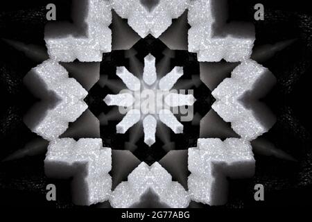 Caleidoscopio con elementi a forma di fiocco di neve nello spazio buio Foto Stock