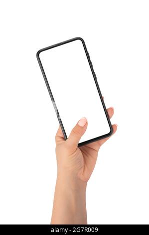 Mano umana che tiene smartphone, dito che tocca schermo vuoto su sfondo bianco isolato primo piano, donna mano tenere telefono cellulare. Donna mano tenere mocku Foto Stock