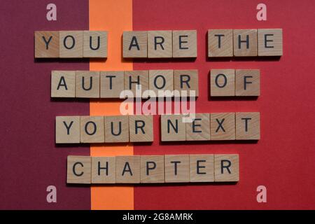 Sei l'autore del tuo prossimo capitolo, frase motivazionale in lettere alfabetiche in legno Foto Stock