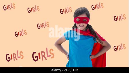 Composizione di testo ragazze su ragazza in costume supereroe Foto Stock