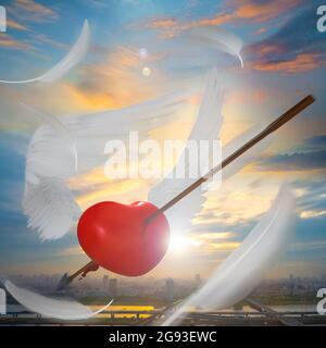 Rendering 3D di un cuore rosso con Angel Wings Shot in aria con le piume frantumate Foto Stock