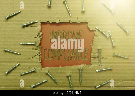 Segno di testo che mostra migliora la conformità. Azione della foto concettuale o fatto di rispettare un desiderio o un comando Smart Office Plans sviluppo della costruzione Foto Stock