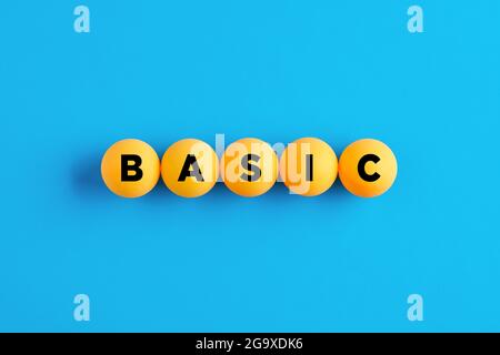 La parola BASIC scritta su palline gialle su sfondo blu. Foto Stock