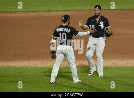 Chicago, Stati Uniti. 31 luglio 2021. Chicago White Sox Yoan Moncada (10) e Jose Abreu (79) festeggiano la loro vittoria 6-4 sugli indiani Cleveland al campo a tasso garantito a Chicago venerdì 30 luglio 2021. Photo by Mark Black/UPI Credit: UPI/Alamy Live News Foto Stock