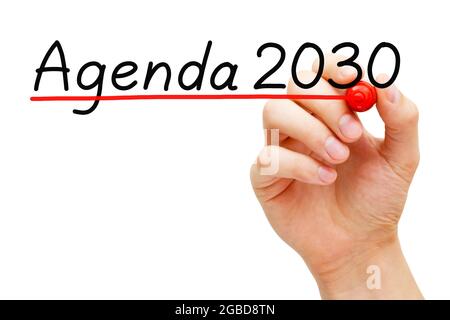 Scrittura a mano Agenda 2030 con marcatore isolato su bianco. Concetto sul piano d'azione globale per gli obiettivi di sviluppo sostenibile. Foto Stock