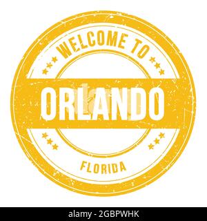 BENVENUTI A ORLANDO - FLORIDA, parole scritte sul francobollo rotondo giallo Foto Stock